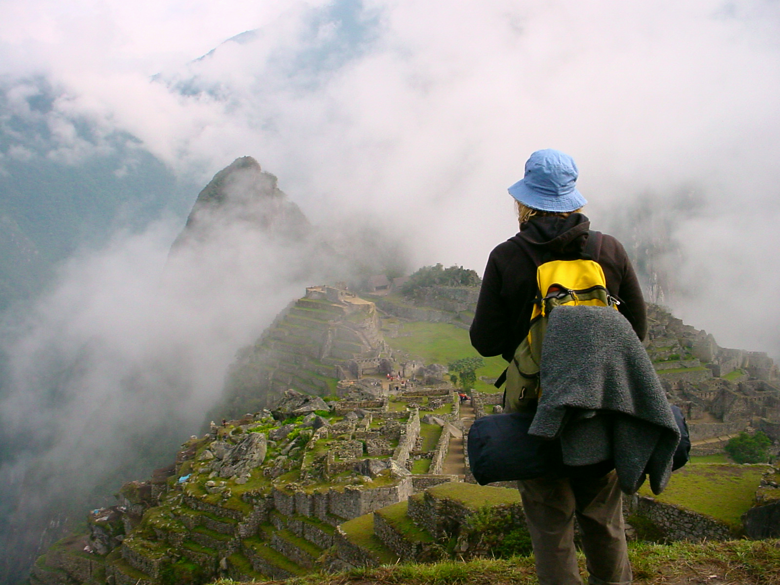 Woman overlooking at Machu Picchu