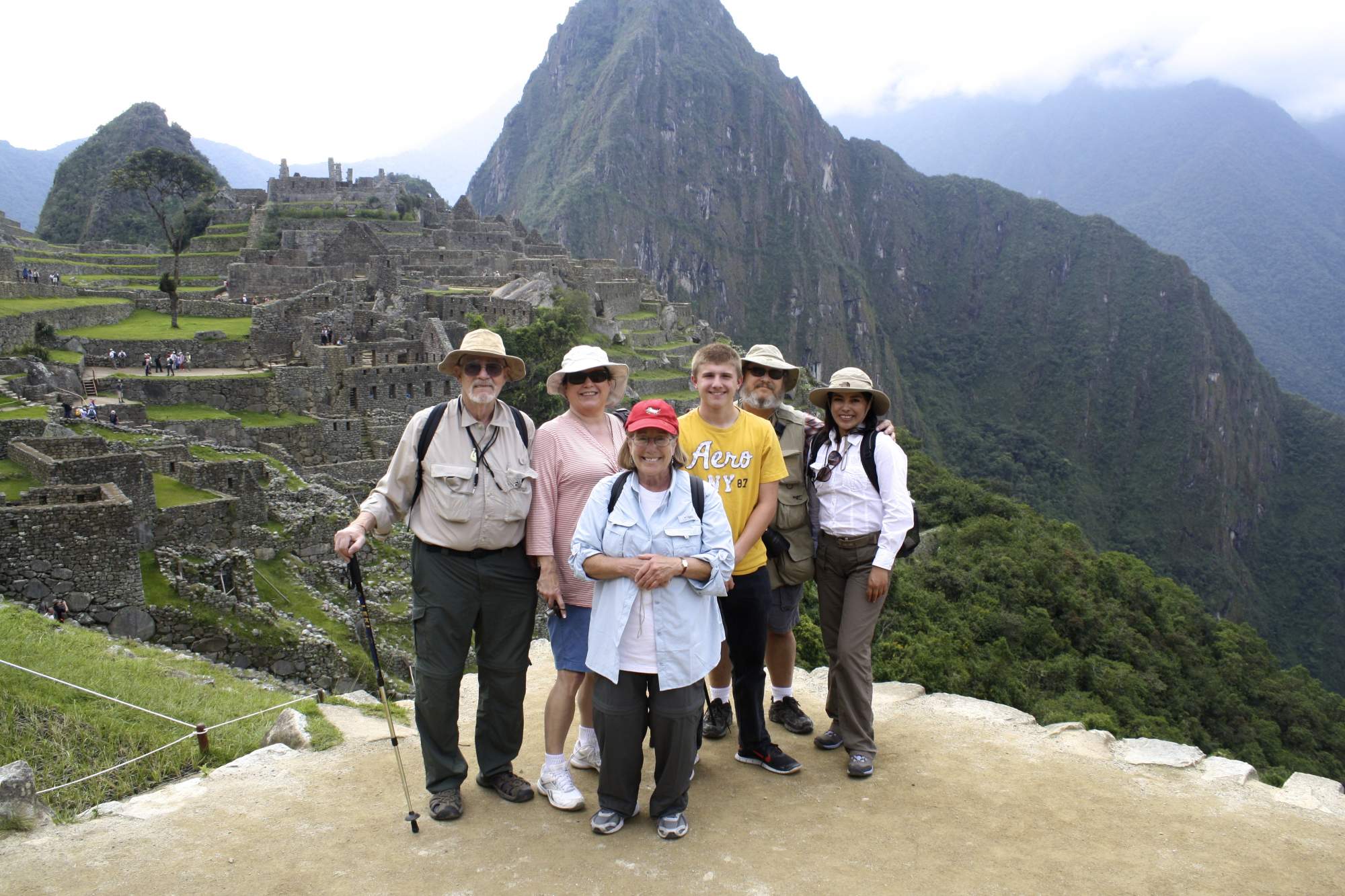 Family posing in front of Machu Picchu