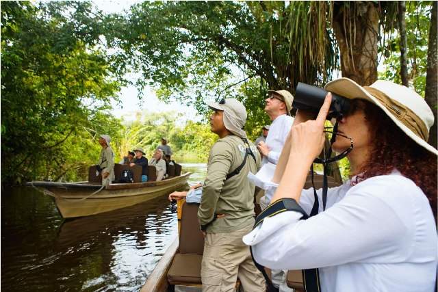 group of people birdwatching in the peruvian amazon